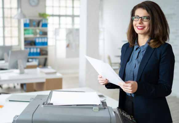 Woman at business printer