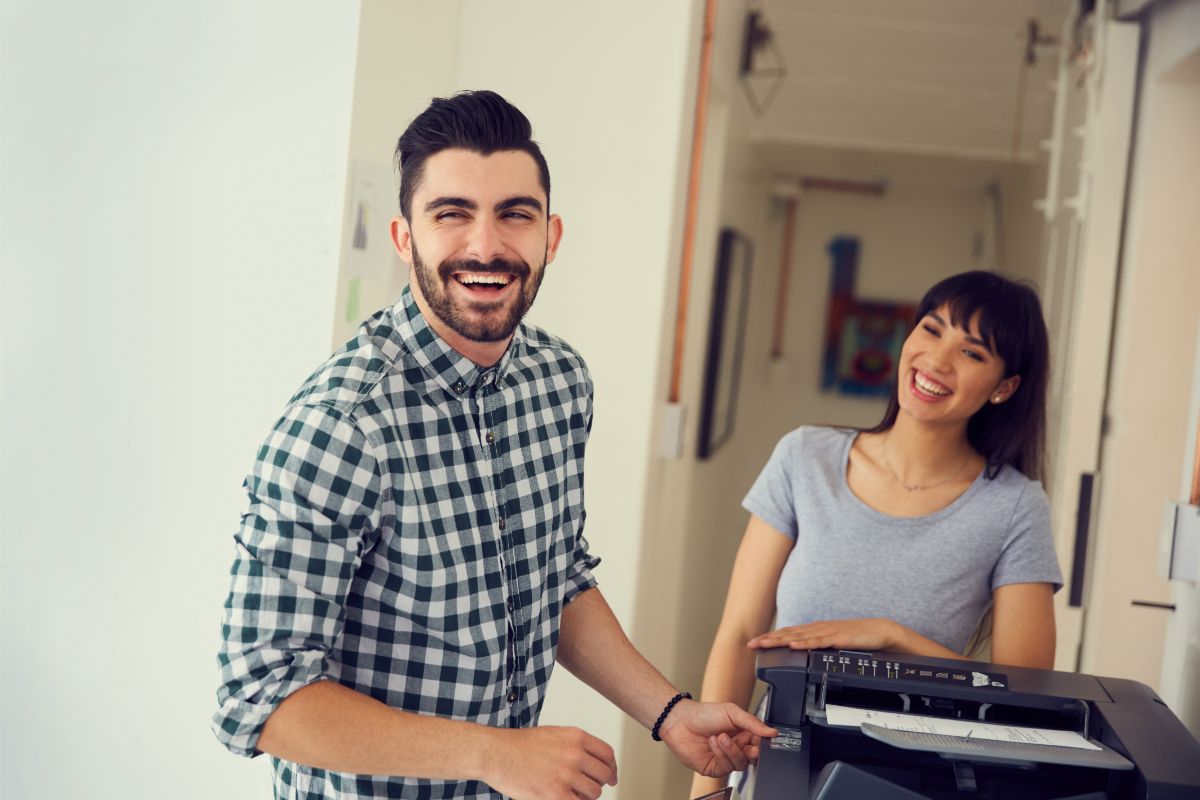 employees-using-copier-rental Employees Using Copier Rental in Office
