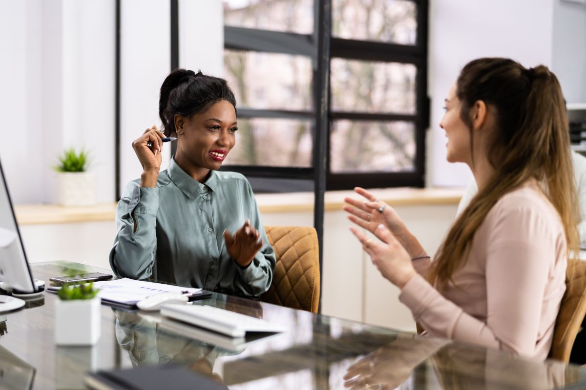 woman-discussing-printer-copiers Women discussing printer copier leases