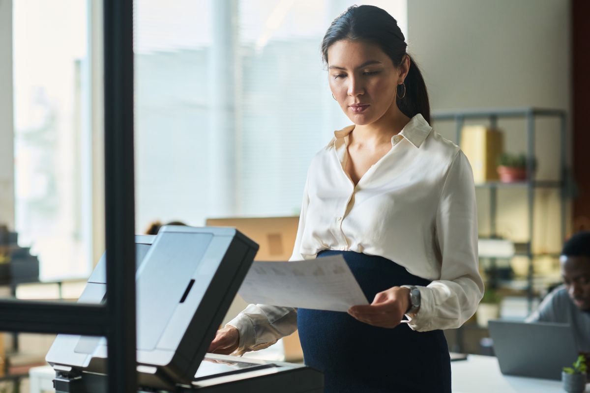 copiers-west-palm-beach-partner Woman using a business copier in W. Palm Beach