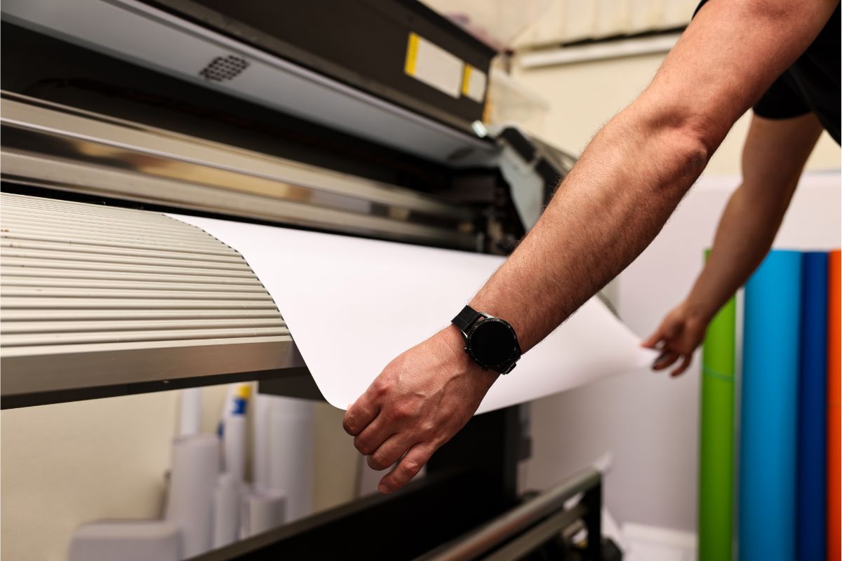 wide-format-printer-man-using Florida Businesses using Wide Format Printer