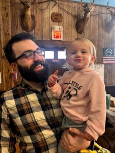 Zach and his God-Daughter Serena.