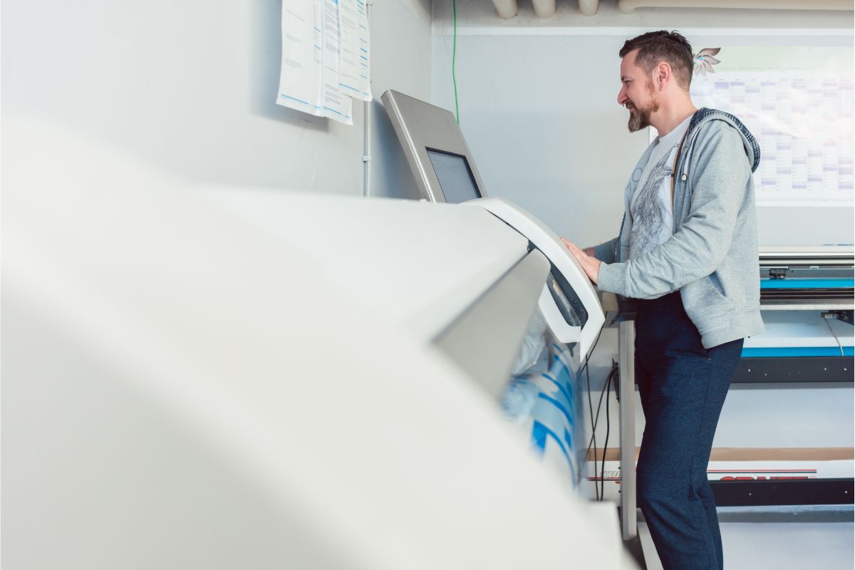 sarasota-florida-wide-format Man using a printer in a Sarasota Florida Office