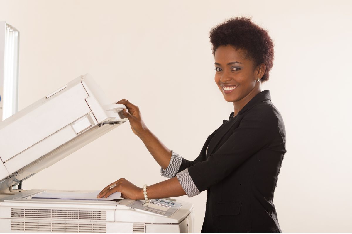 Woman Using a copy Machine in Florida business