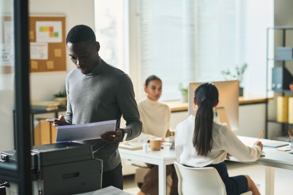 Man using a canon copier