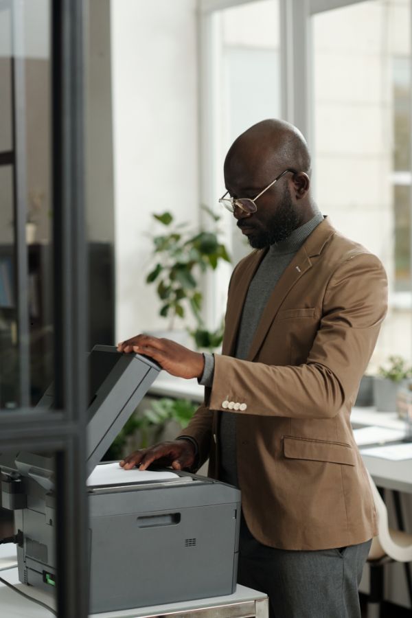 man-in-ri-using-copier Man in RI using a copy machine