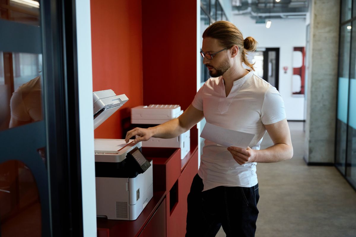 new-york-mutlifunction-copiers Man using a Multifunction Copier in New York