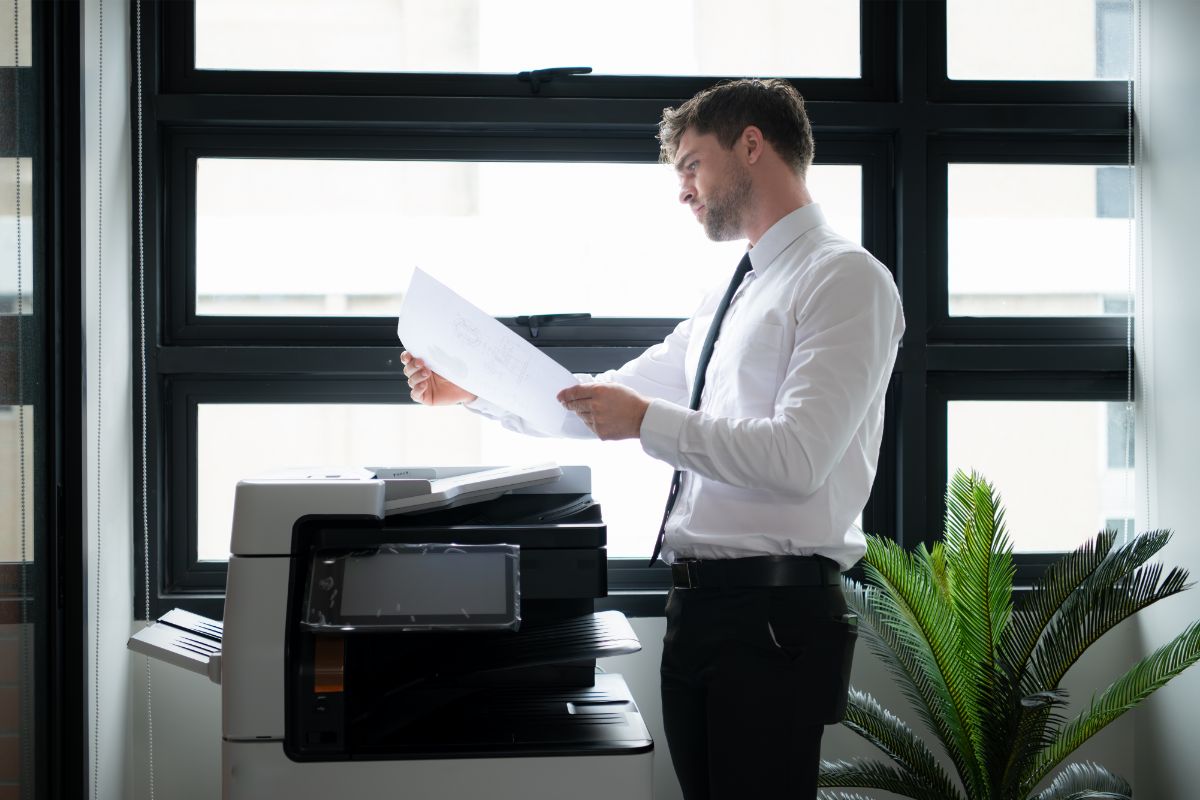 Man using a Business copier in Syracuse Office