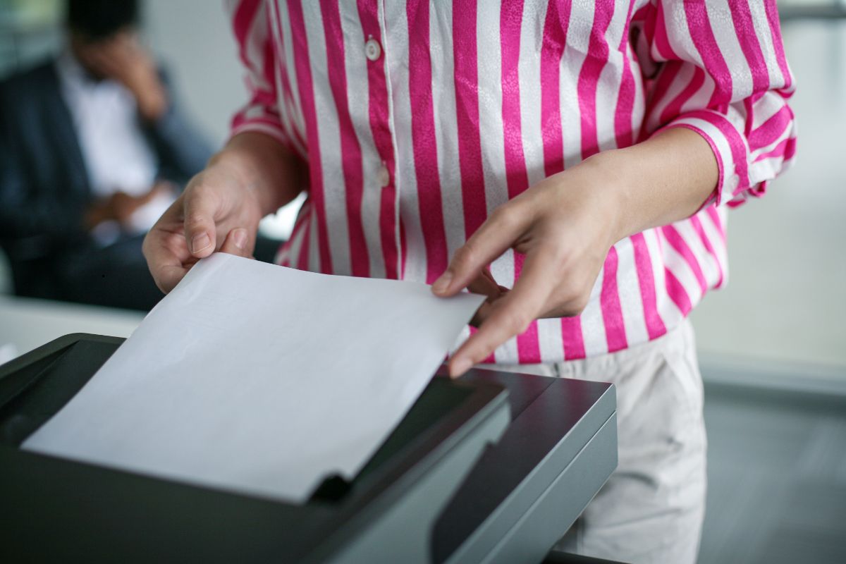 Woman using a photocopier in Albany, NY