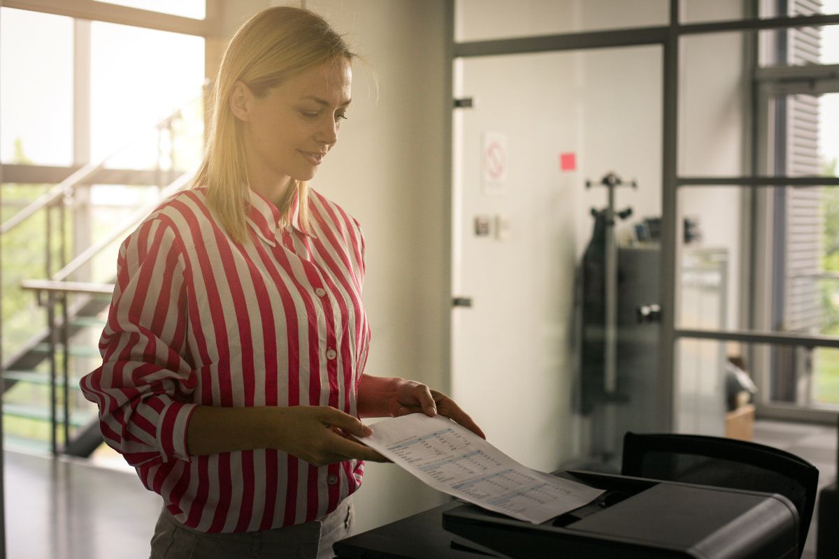 Woman using a copier in Cranston