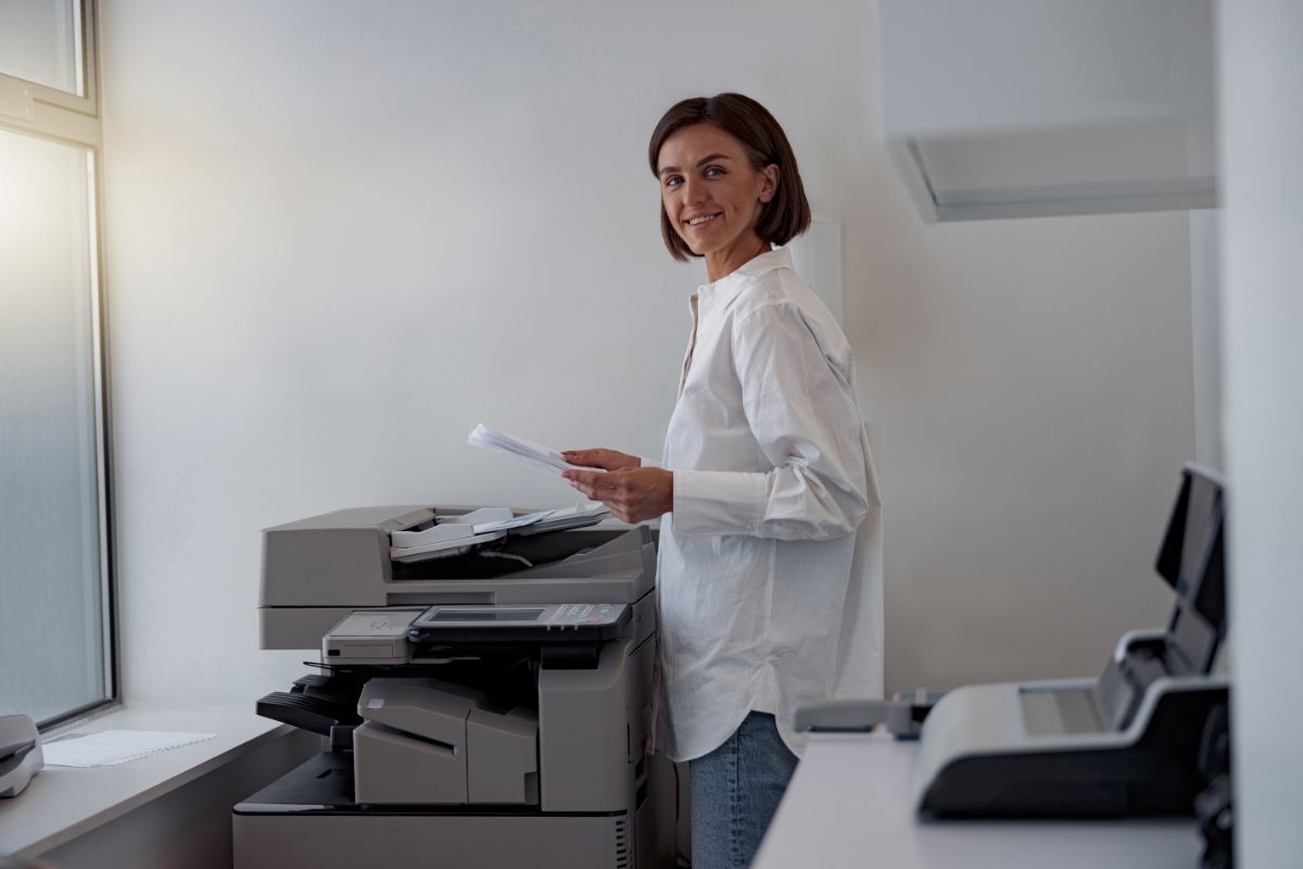 Woman using a printer in Providence