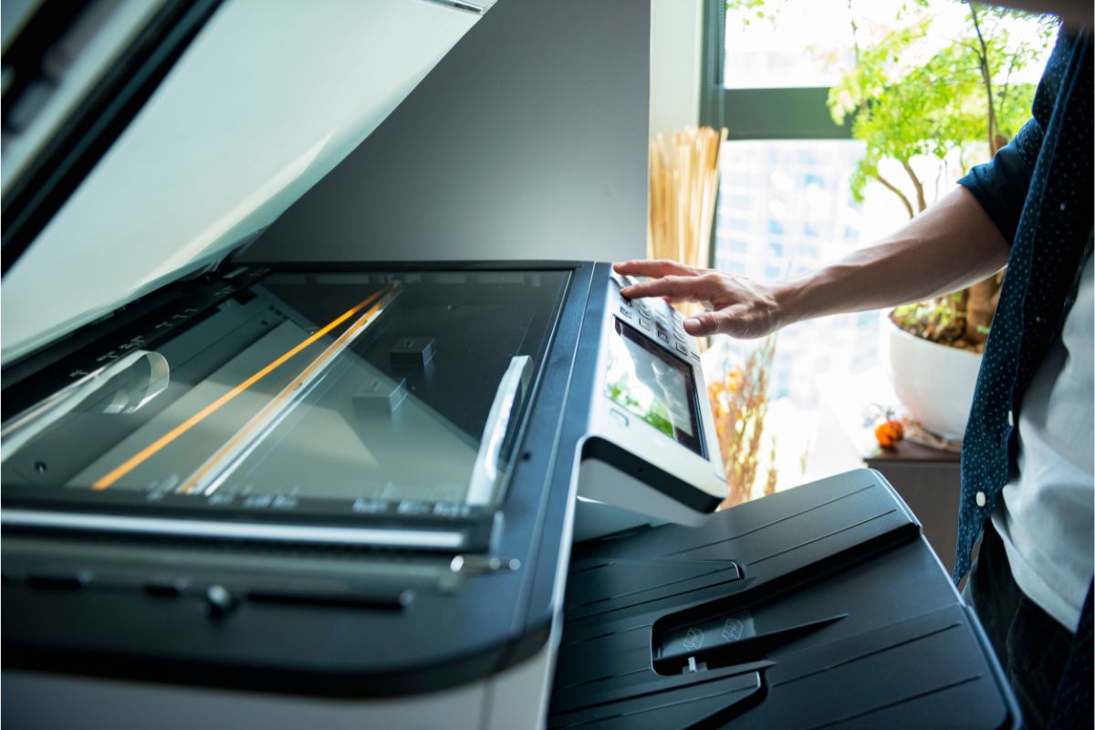 Man using a canon copier/printer
