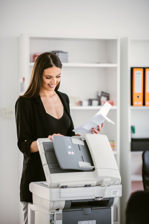 Woman using a multifunction printer rental