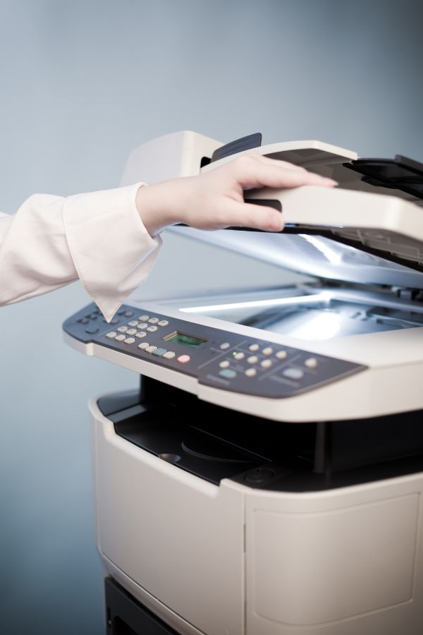 Woman using an all in one printer